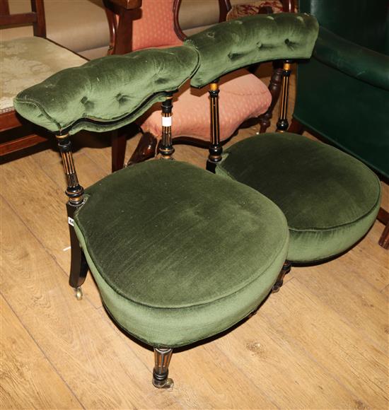 A pair of Victorian ebonised nursing chairs
